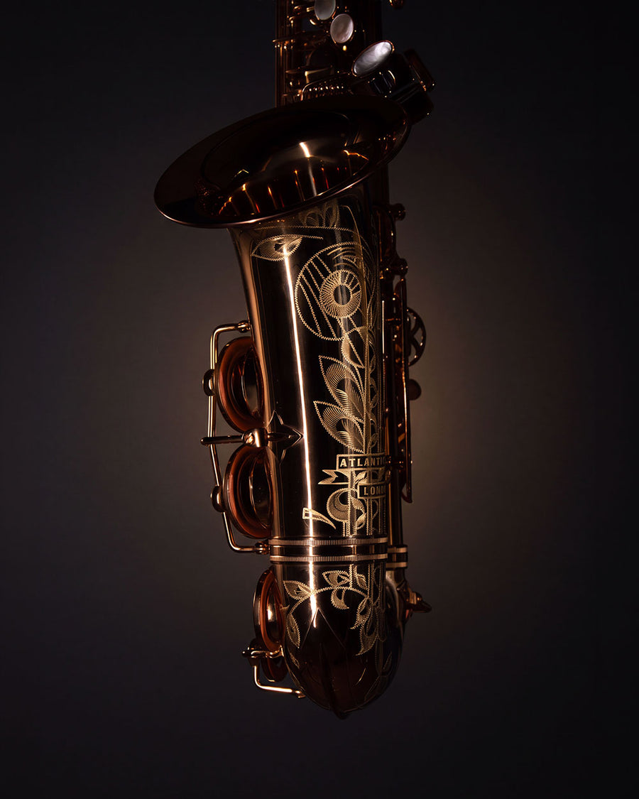 Warm brass and engraved bell of The Duke Alto