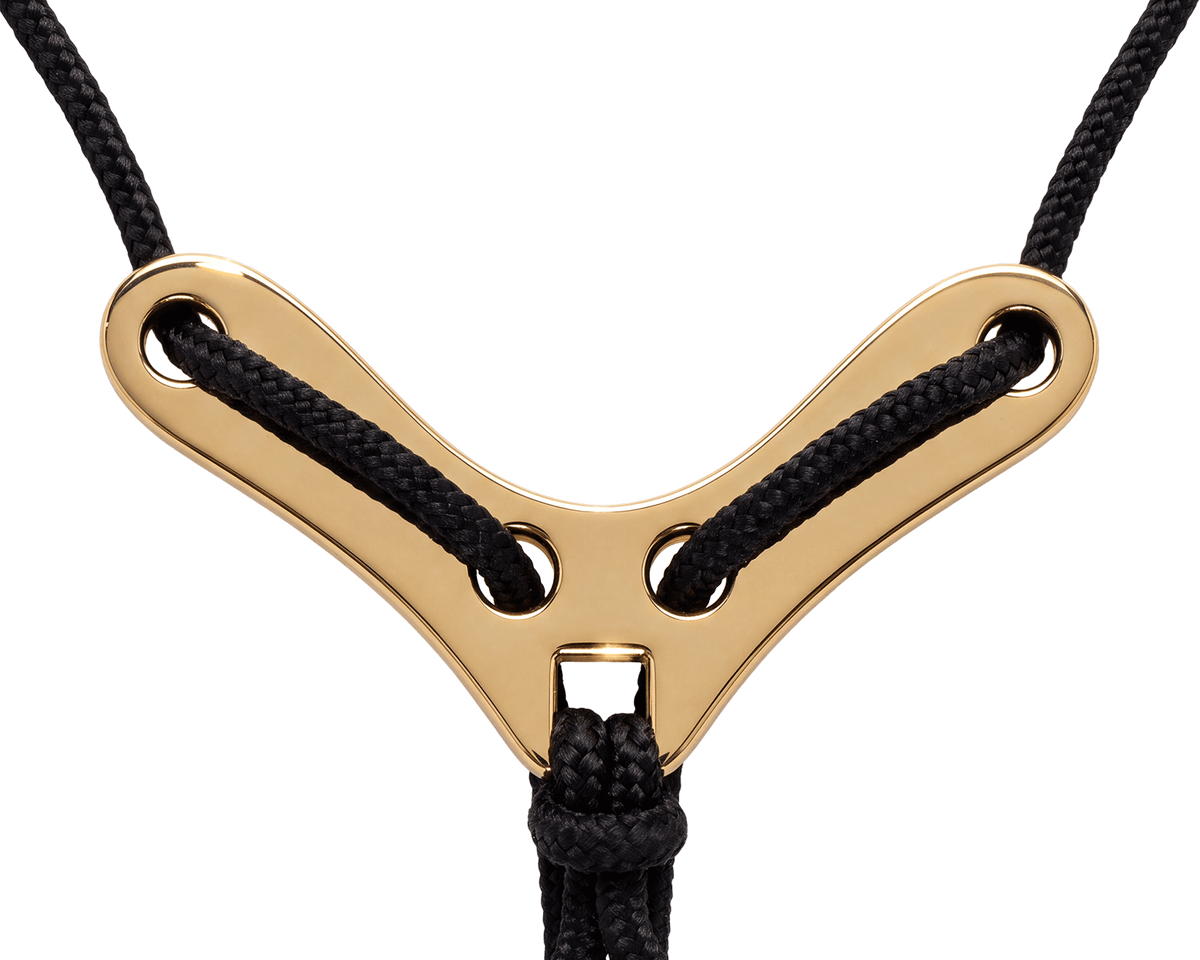 Belgravia gold-coloured solid-metal adjuster with broad shoulders holding the black cords apart