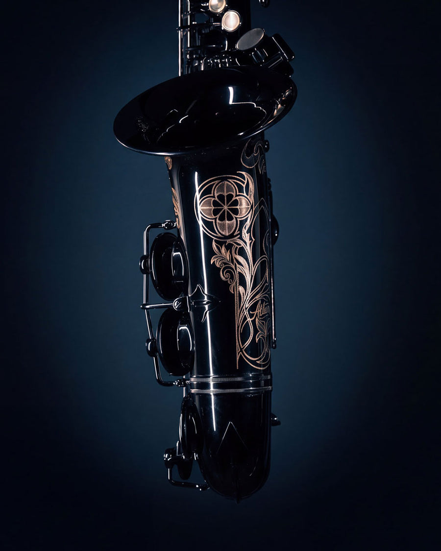 The Baron's intricate engraving against its dark finish