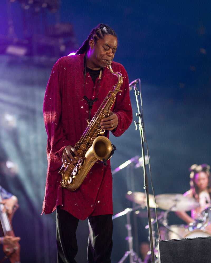 Courtney Pine performing with The Duke under blue stage lights